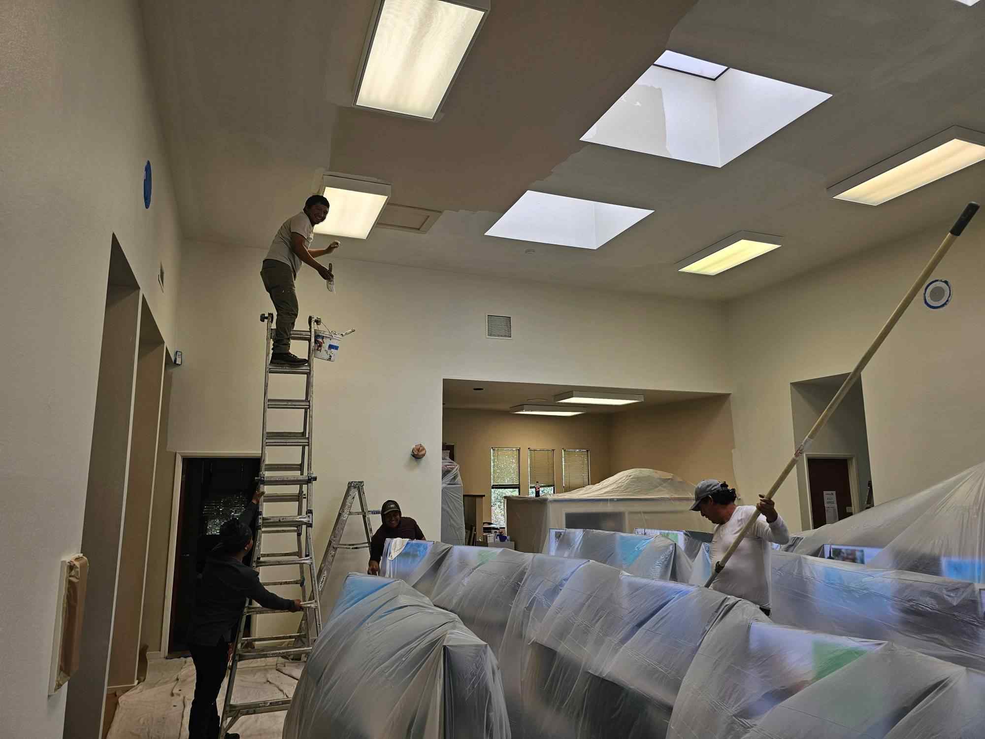 painting-contractor-inspecting-luxury-home-interior